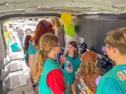 Girl scouts inside STEM van