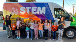 Kids next to STEM van