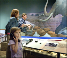 Photo of guests viewing exhibit displays and listening to audio devices in the Ancient Basin